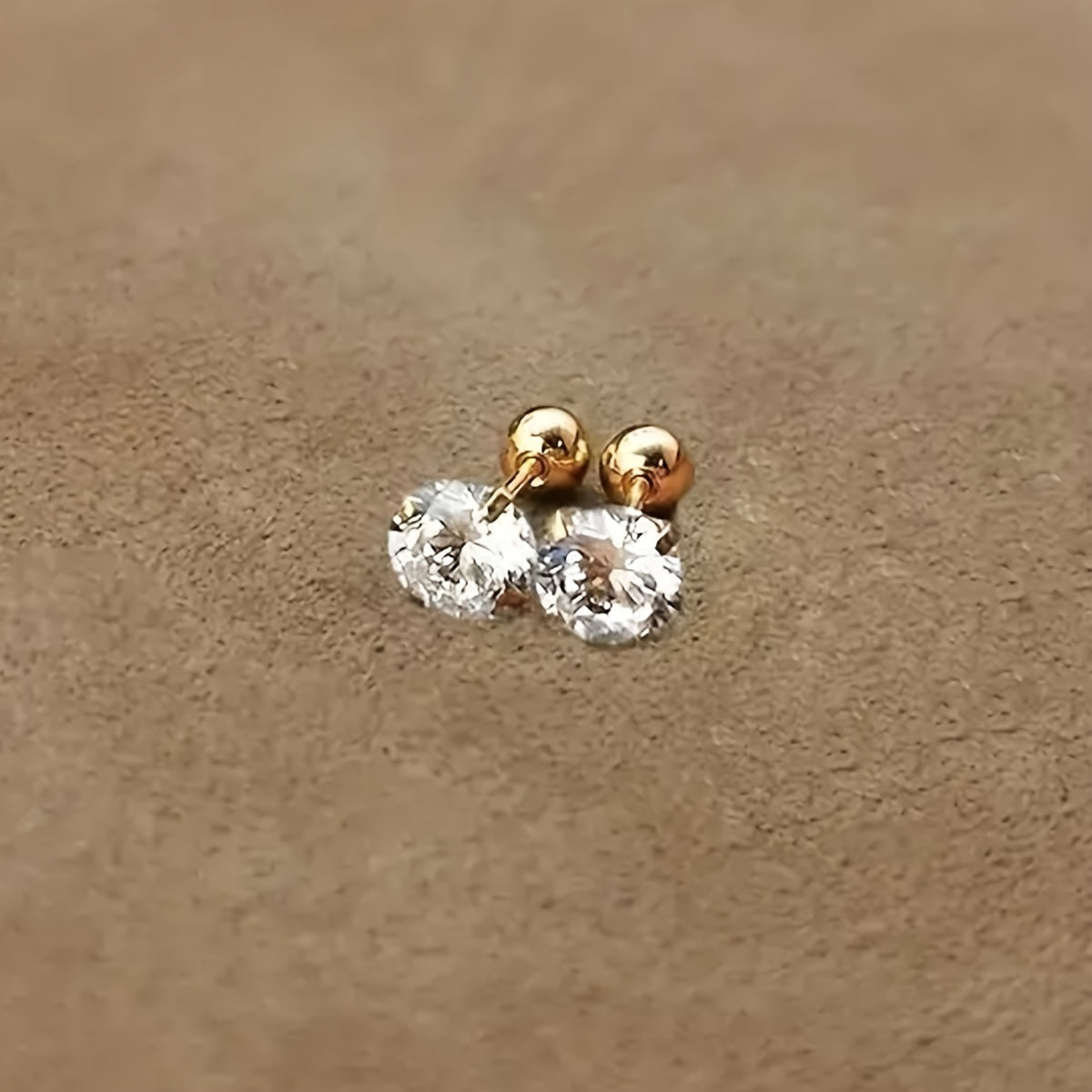 Boucles d’oreilles torsadées zircon